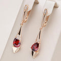 Colgante elegante con cristal rojo en dorado