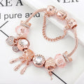 Pulsera atrapasueños rosa con colgantes en tono plateado