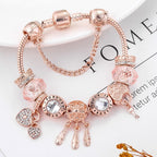 Pulsera atrapasueños rosa con colgantes en tono plateado