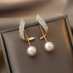 Pendientes de perla con detalle dorado