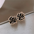 Pendientes elegantes de loto negro en dorado