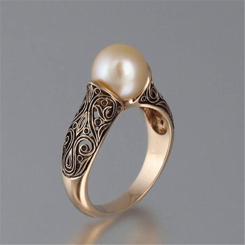 Anillo dorado vintage con perla